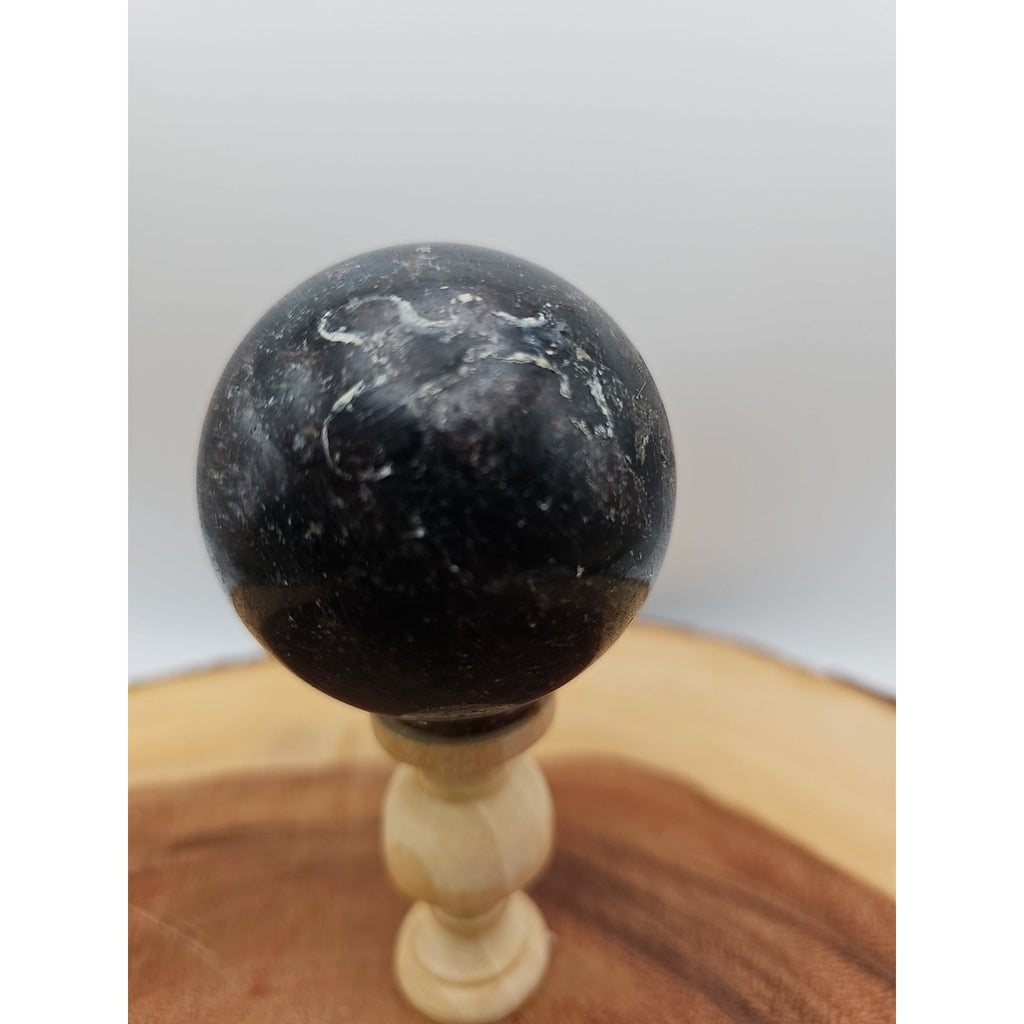 Arfvedsonite Garnet Sphere 276g With Stand by CrystalCloud Company