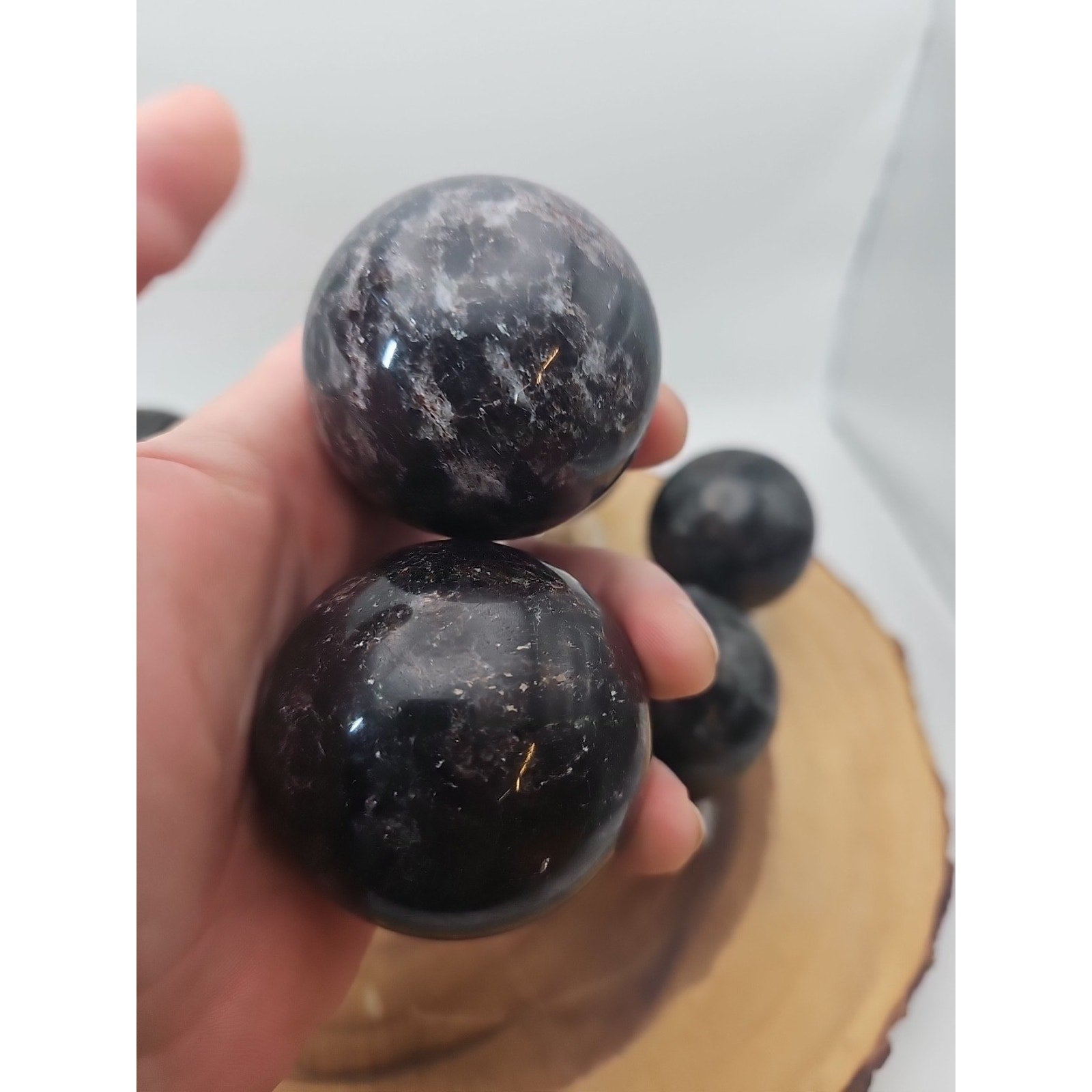 Quartz Crystal Sphere 50mm 1 Each Arfvedsonite Garnet Flash by CrystalCloud Company