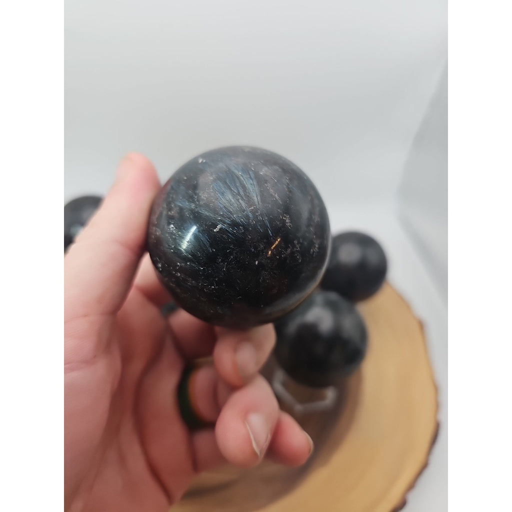 Quartz Crystal Sphere 50mm 1 Each Arfvedsonite Garnet Flash by CrystalCloud Company